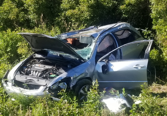 A Hamilton woman was airlifted to hospital after driving into a ditch on Highway 54.