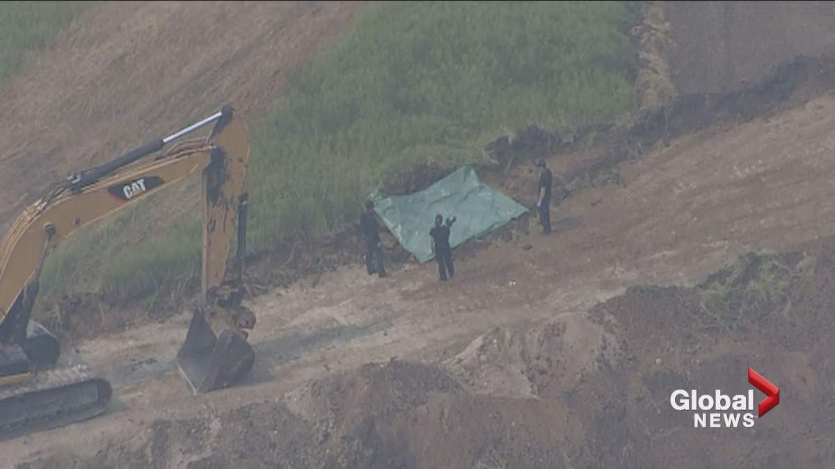 RCMP are investigating following the discovery of human remains at a construction site in Okotoks, Alta., on July 17, 2017.