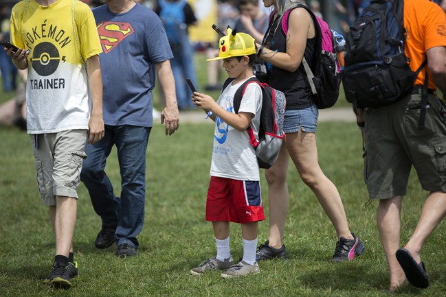 Landon Robles, 8, wears a Pikachu hat at the Pokemon Go Fest Saturday in Chicago. Many festival attendees had trouble getting the augmented-reality cellphone game to work.