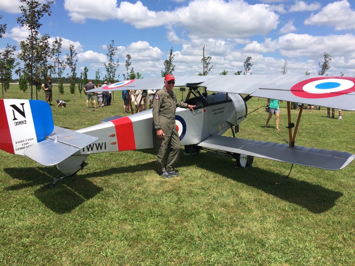 Pilot Dave Wilson stands next to replica world war one Fighter plane he flew over Vimy Ridge. 