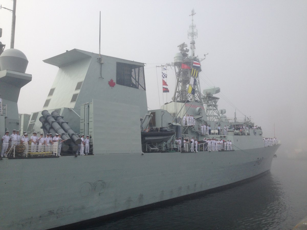 HMCS St. John's returns to Halifax in a sea of fog after a six month deployment. as part of Op REASSURANCE. 