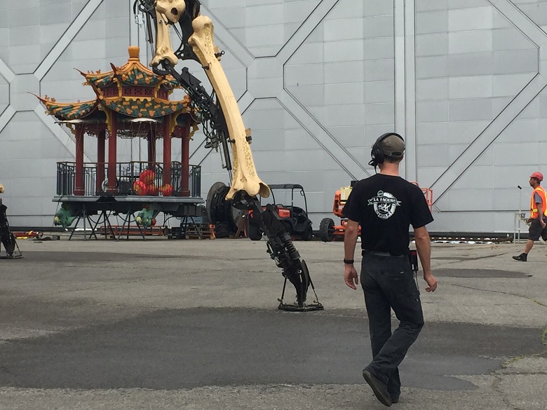 One leg belonging to the giant female spider Kumo hits the pavement in Ottawa on July 19, 2017.