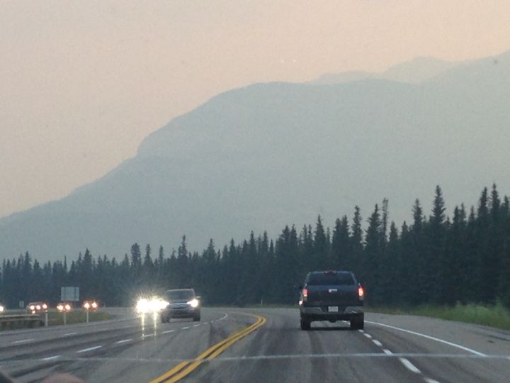 Thick smoke is seen near the gates of Alberta’s Jasper National Park on Monday evening.