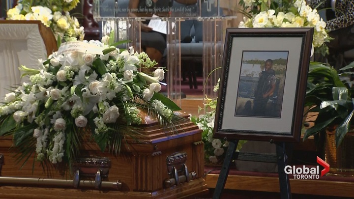 Mourners attend a funeral for 15-year-old Jeremiah Perry on July 24, 2017.