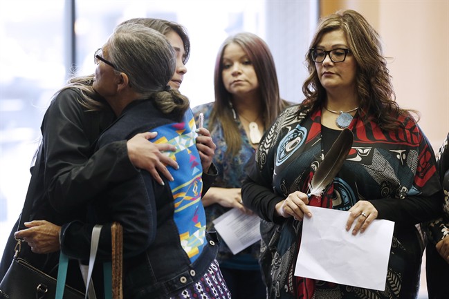 Family members of the Missing and Murdered Indigenous Women and Girls (MMIWG) and Coalition Co-chairs greet each other prior to a press conference calling for a re-organization of the National Inquiry into Missing and Murdered Indigenous Women and Girls in Winnipeg, Wednesday.