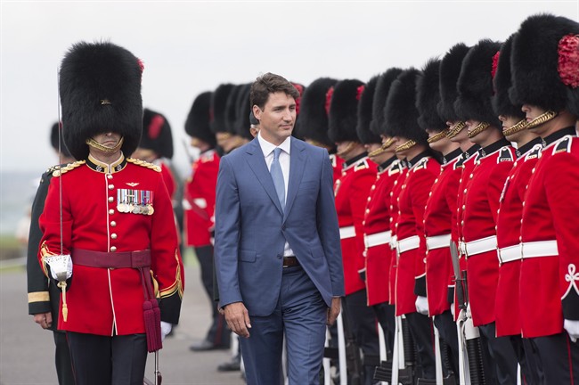 Prime Minister Justin Trudeau inspects the honour guard during a visit at the Citadelle Wednesday, July 19, 2017 in Quebec City. 