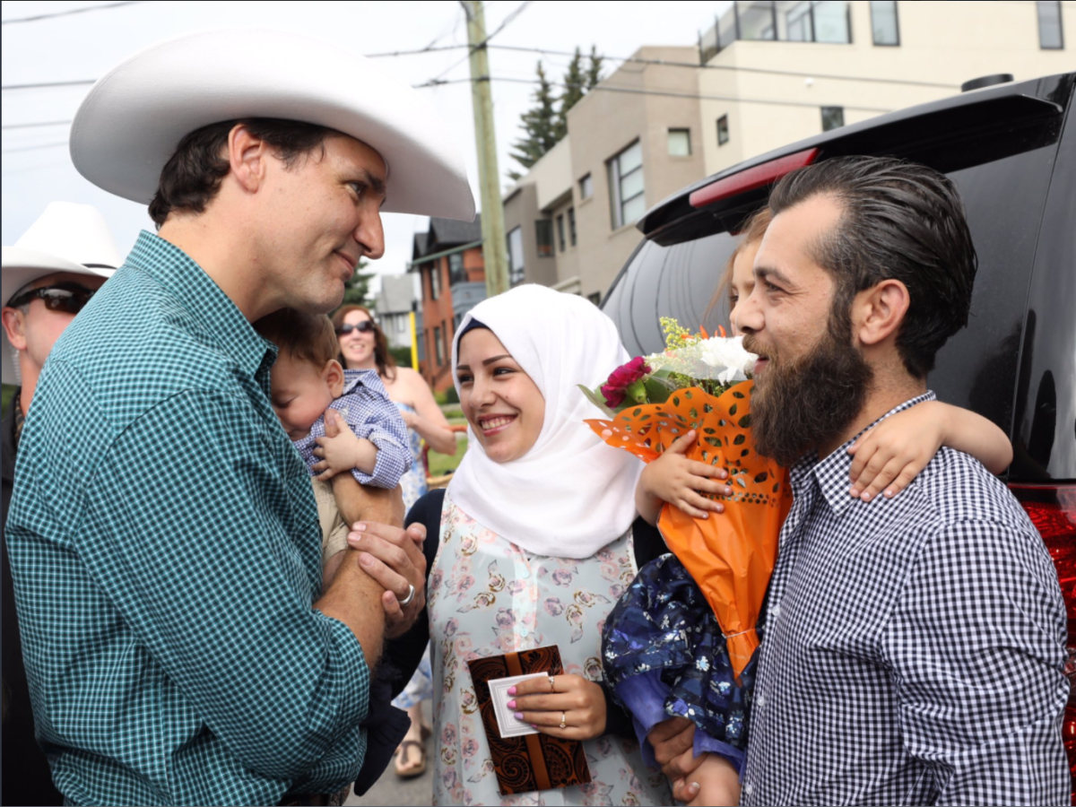 Prime Minister Justin Trudeau holds baby Justin-Trudeau Adam Bilal at the Calgary Stampede on Saturday. 