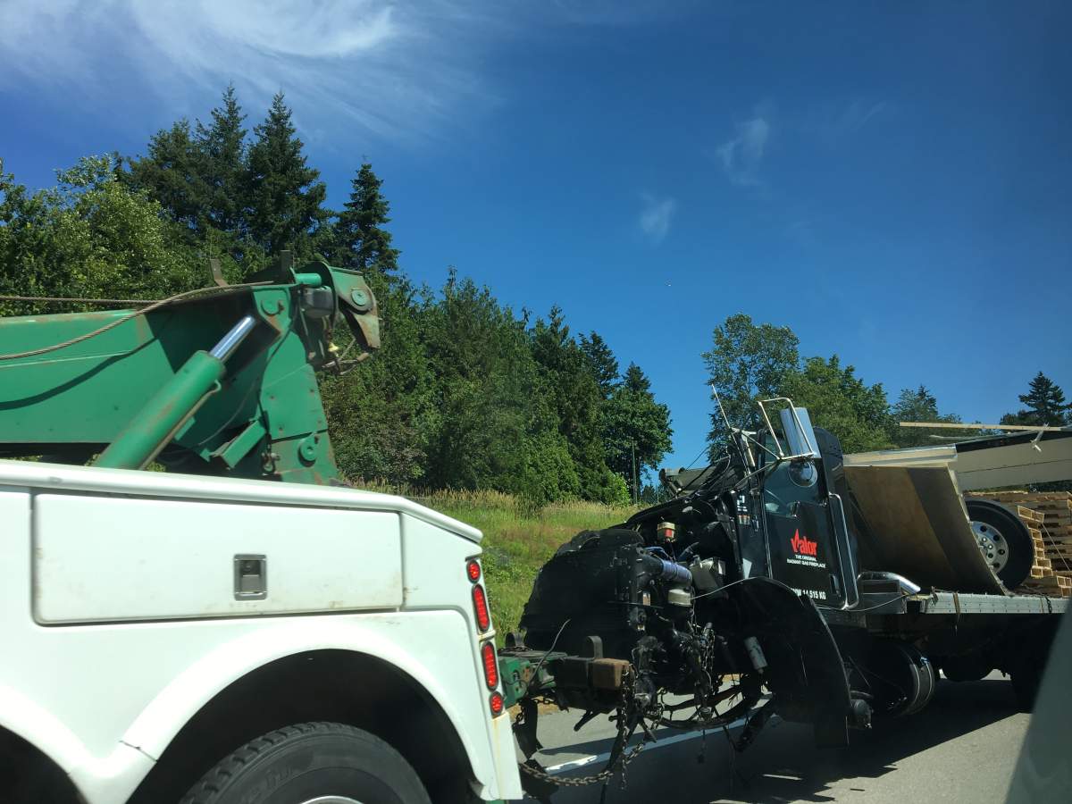 One of the trucks being hauled away from the accident scene. Credit: Paul Haysom / Global News.