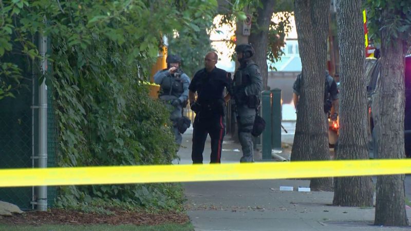 Calgary police surround a building in the downtwon core on Thursday, July 28 after a man barricaded himself inside.