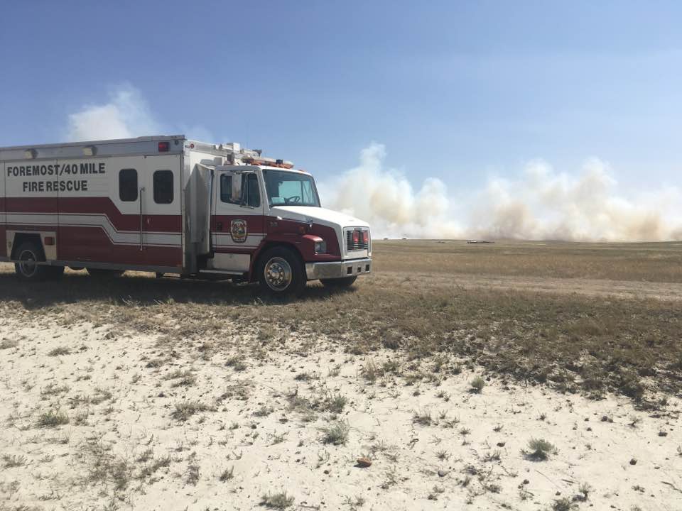 A grass fire near the Milk River Natural Area.