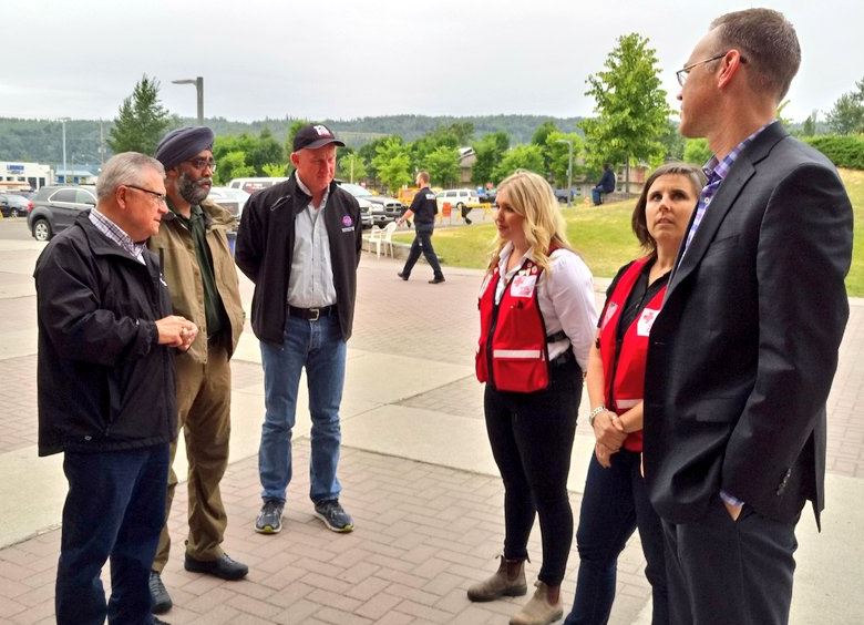 Federal ministers Ralph Goodale and Harjit Sajjan, along with B.C. minister of public safety Mark Farnsworth, meet with representatives of the Canadian Red Cross in Kamloops on Saturday, July 22.