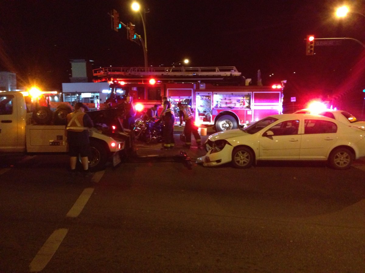 Emergency crews clear the intersection after an accident at Glenmore and High roads in Kelowna Thursday night. 