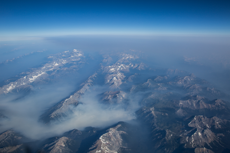 Smoke from wildfires burning in British Columbia and Alberta is seen drifting through the Rocky Mountains.