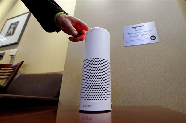 In this May 17, 2017 file photo, an Amazon Alexa device is switched on for a demonstration of its use in a ballpark suite before a Seattle Mariners baseball game in Seattle.