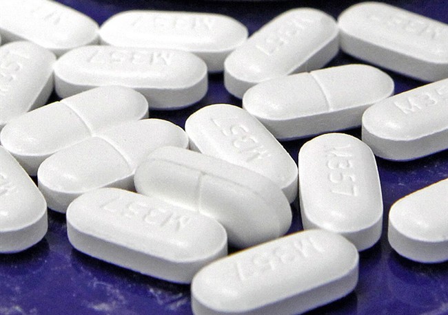 FILE - This Feb. 19, 2013 file photo shows hydrocodone-acetaminophen pills, also known as Vicodin, arranged for a photo at a pharmacy in Montpelier, Vt. 