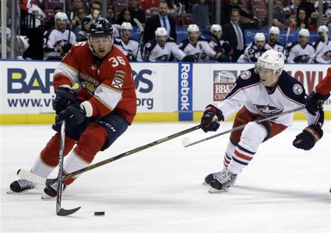 FILE - In this Jan. 14, 2017, file photo, Florida Panthers left wing Jussi Jokinen (36) skates with the puck as Columbus Blue Jackets left wing Matt Calvert (11) defends during the second period of an NHL hockey game in Sunrise, Fla. 