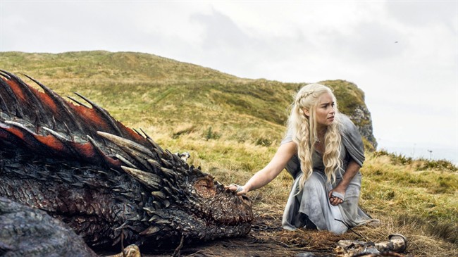 In this file image released by HBO, Emilia Clarke appears in a scene from "Game of Thrones," as the menacing, white-haired Daenerys Targaryen, aka Khaleesi, aka "Mother of Dragons.".