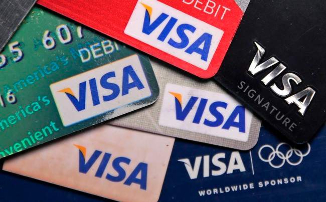 This Wednesday, June 4, 2014, file photo shows a selection of Visa cards in Boston. 