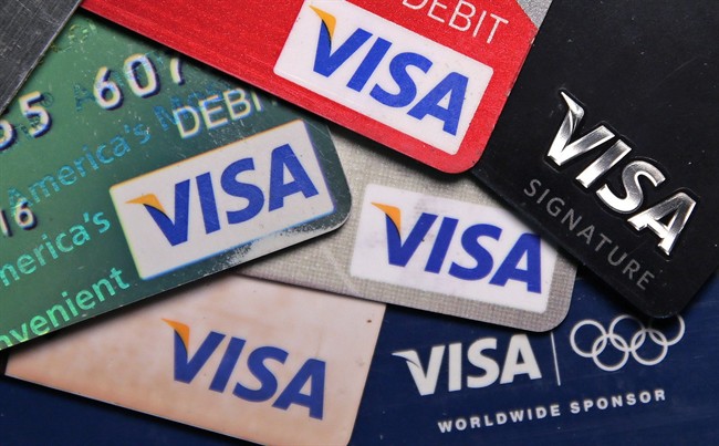 This Wednesday, June 4, 2014, file photo shows a selection of Visa cards in Boston. 