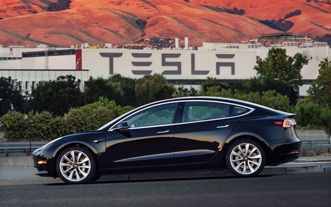 This undated image provided by Tesla Motors shows the Tesla Model 3 sedan. 