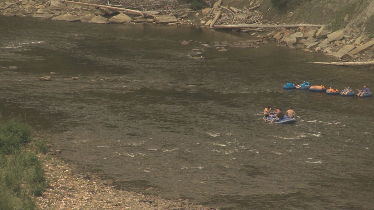 People tubing down the Pembina River in July 2014, about 100 kilometres west of Edmonton.