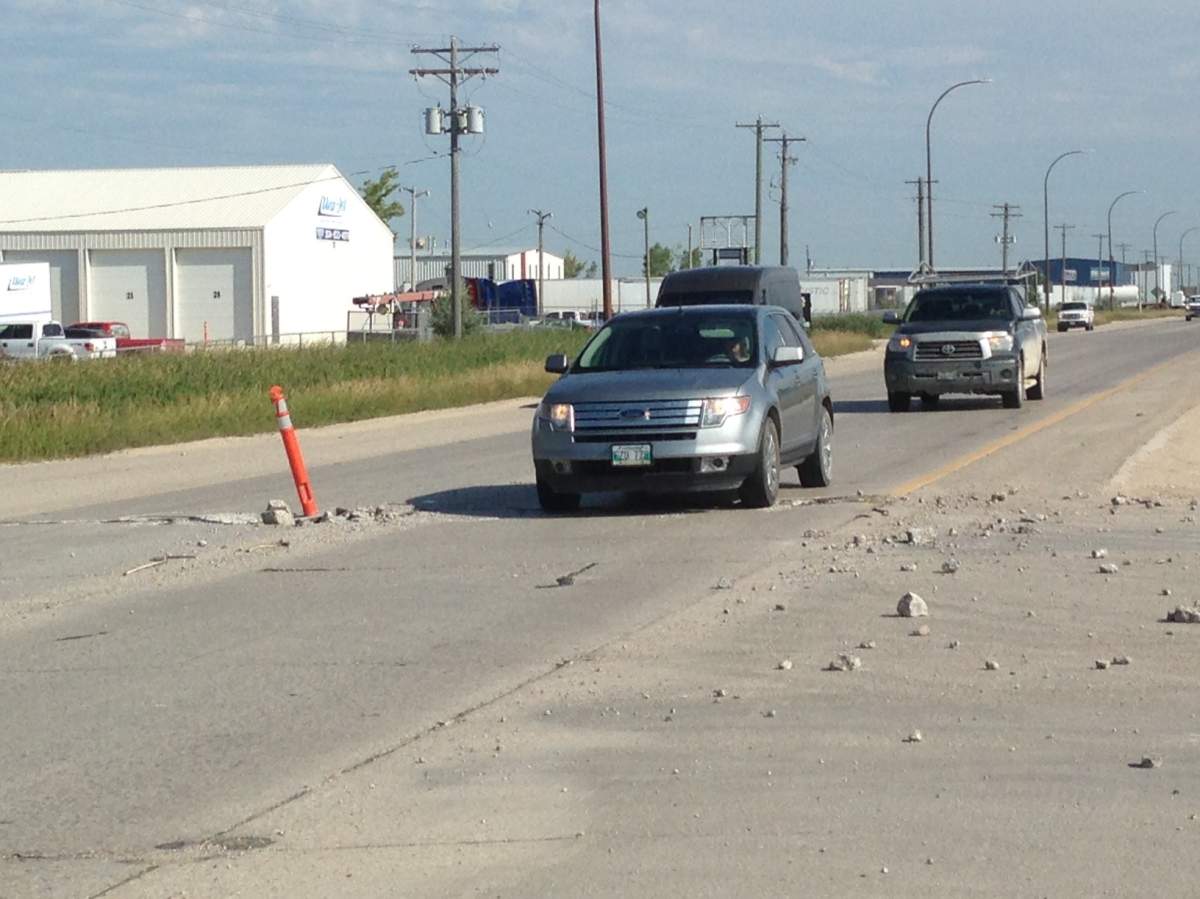 Parts of Brookside Boulevard closed after heat causes road to heave - image