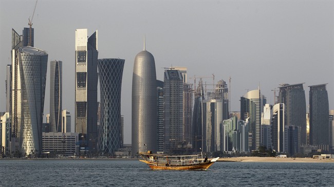 A traditional dhow floats in the Corniche Bay of Doha, Qatar.