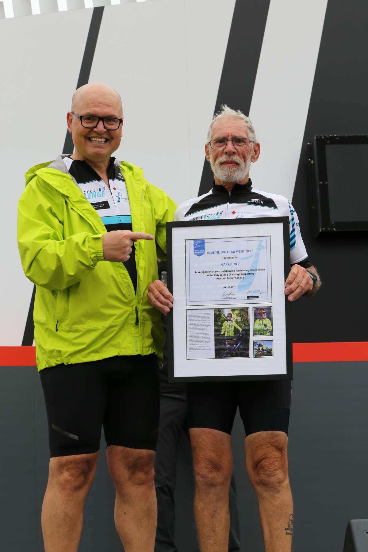 Gary Jones is shown holding the Blue Tie Circle Award for excellence in prostate cancer fundraising.