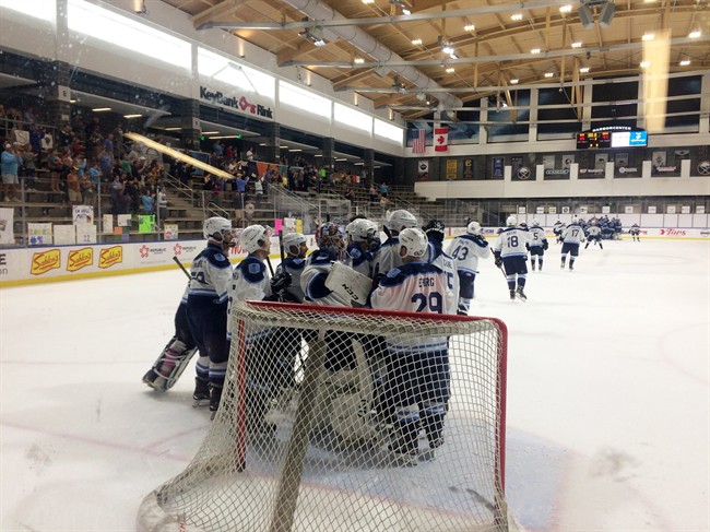 After gathering to celebrate around their own goal, Team White players head to centre ice to shake hands with their Blue Team counterparts at Buffalo's downtown HarborCenter on Monday morning, Monday, July 3, 2017, after playing for more than 250 hours to set the world record for the longest continuous hockey game.