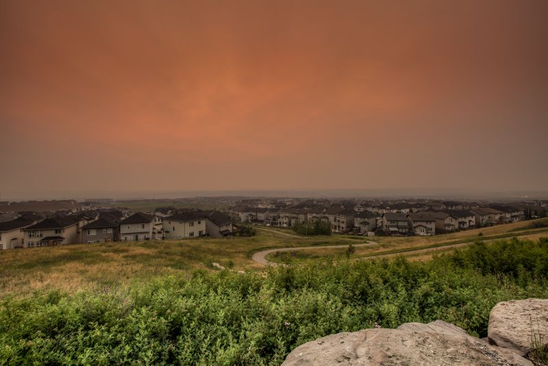 A smoky sunrise in Calgary on Monday, July 17, 2017 as seen from the community of Nolan Hill.