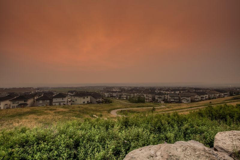 A smoky sunrise in Calgary on Monday, July 17, 2017 as seen from the community of Nolan Hill. 