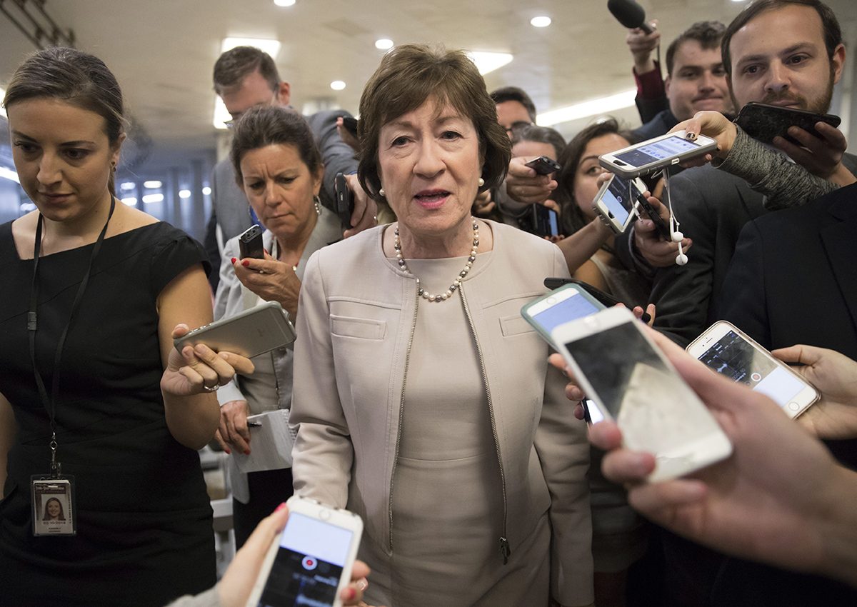 Sen. Susan Collins, R-Maine is surrounded by reporters as she arrives on Capitol Hill in Washington, Tuesday, July 25, 2017, before a test vote on the Republican health care bill. 