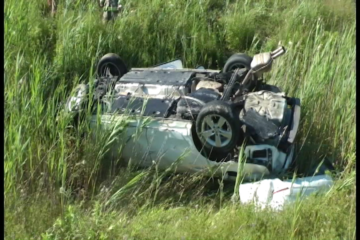 A vehicle flipped onto its roof on the on-ramp to Hwy 401 in Cobourg .