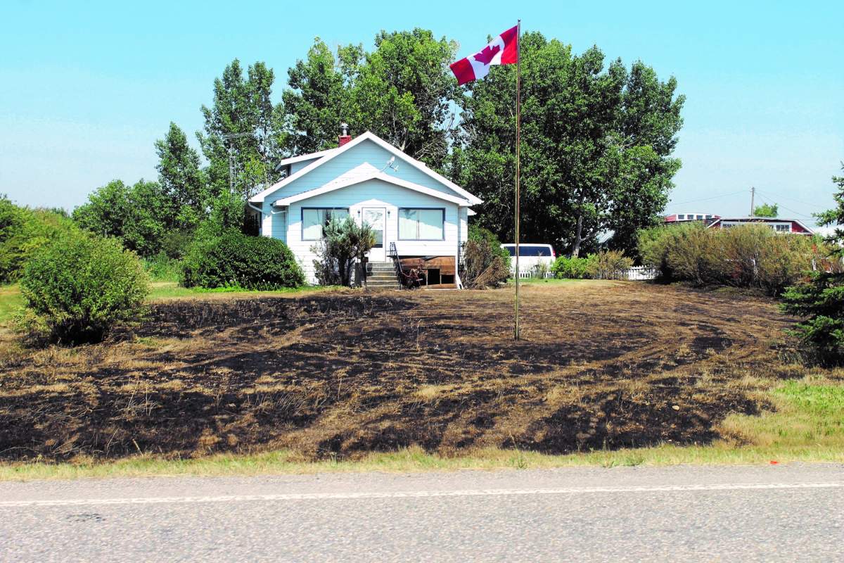 A house along Highway 520 suffered fire damage after a suspected passing vehicle created a spark