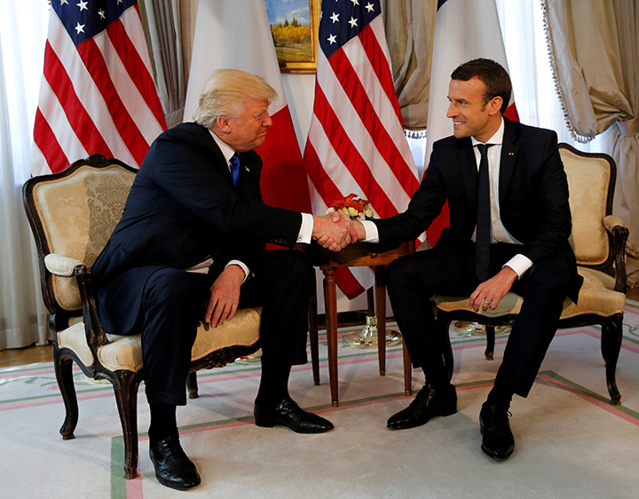 U.S. President Donald Trump and French President Emmanuel Macron shake hands before a lunch ahead of a NATO Summit in Brussels, Belgium, May 25, 2017.  