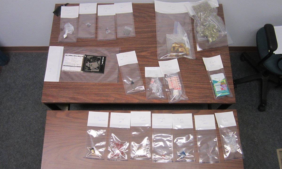 Police seized drugs and $2,980 in cash following a traffic stop in Turner Valley on July 11, 2017.