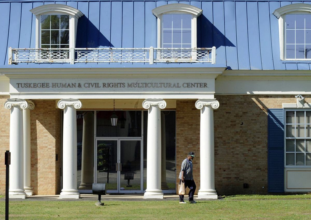 In this Tuesday, April 4, 2017 photo, an unidentified man walks past the Tuskegee Human and Civil Rights Multicultural Center in Tuskegee, Ala. 