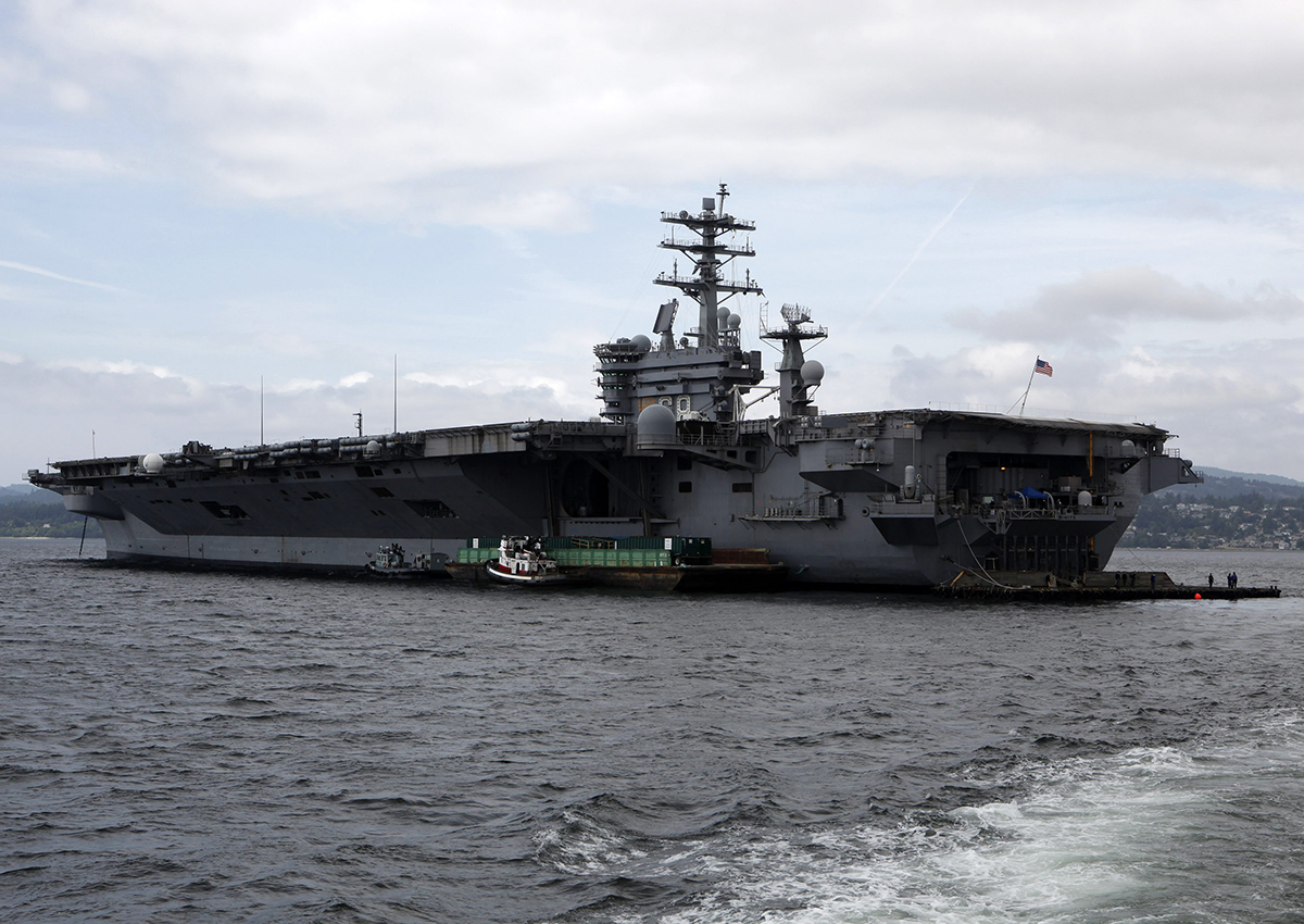 Launched May 13, 1972, the 39-year-old USS Nimitz, a 23-story tall, 1,115 foot nuclear powered aircraft super-carrier of the United States Navy holds a crew of nearly 3,000 men and women personnel anchors in the Juan de Fuca Strait near Victoria, B.C., June 14, 2014.
