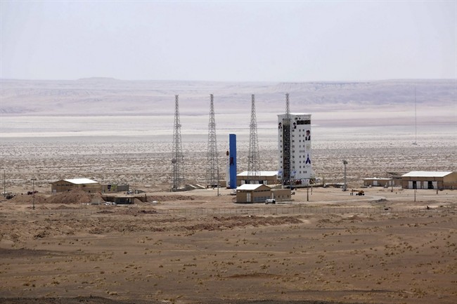 This picture released by the official website of the Iranian Defense Ministry on Thursday, July 27, 2017, claims to show the Simorgh satellite-carrying rocket, center, before being launched into space from Imam Khomeini National Space Center in an undisclosed location, Iran. 