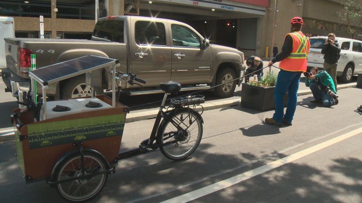 Edmonton is using two solar-powered watering trikes to water the 100 planters along Edmonton's downtown bike network.