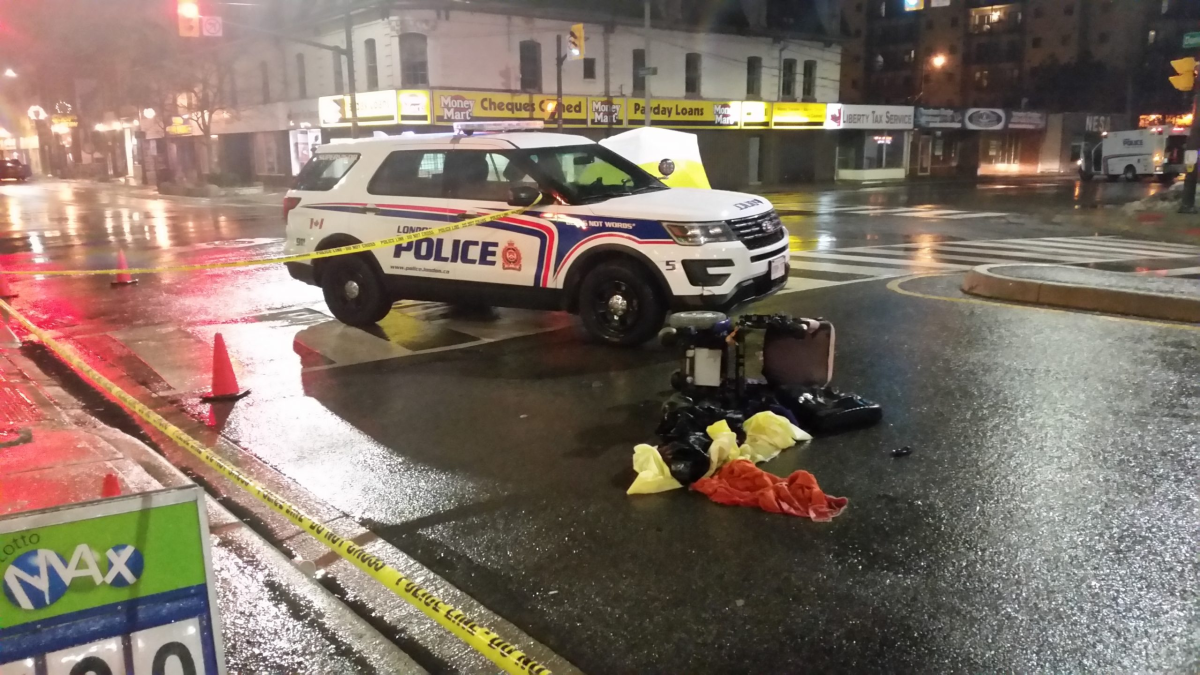 London police tape off part of the intersection of Adelaide St. and Dundas St. after a cruiser struck a woman in a motorized wheelchair on Jan. 16, 2017.