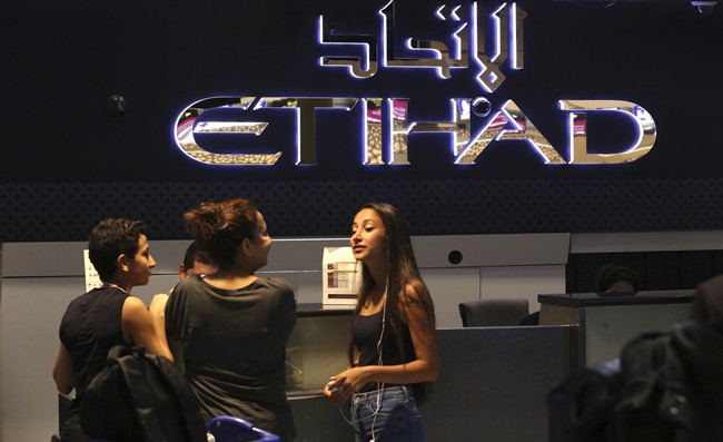 Passengers check into a flight at Abu Dhabi International Airport in Abu Dhabi, United Arab Emirates, Tuesday, July 4, 2017.