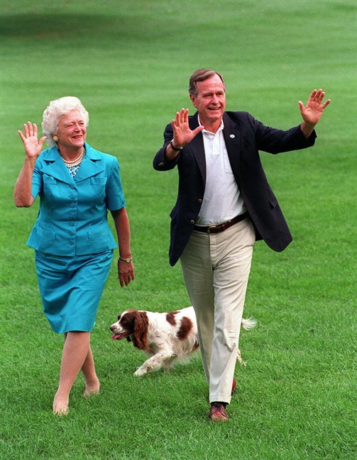 President Bush, right, and first lady Barbara Bush walking with their dog Millie across the South Lawn as they return to the White House