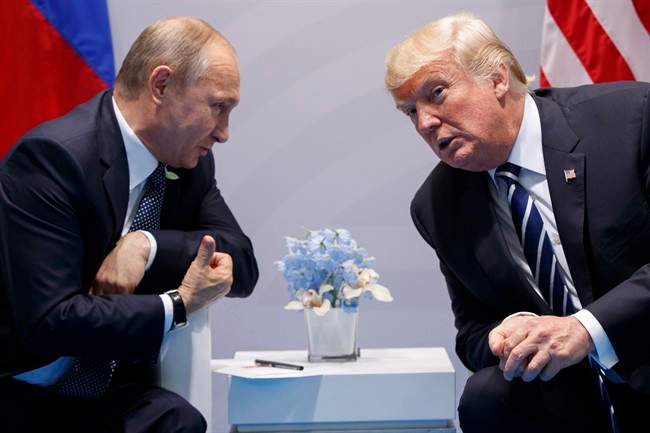 In this July 7, 2017, file photo, President Donald Trump meets with Russian President Vladimir Putin at the G20 Summit in Hamburg, Germany. 