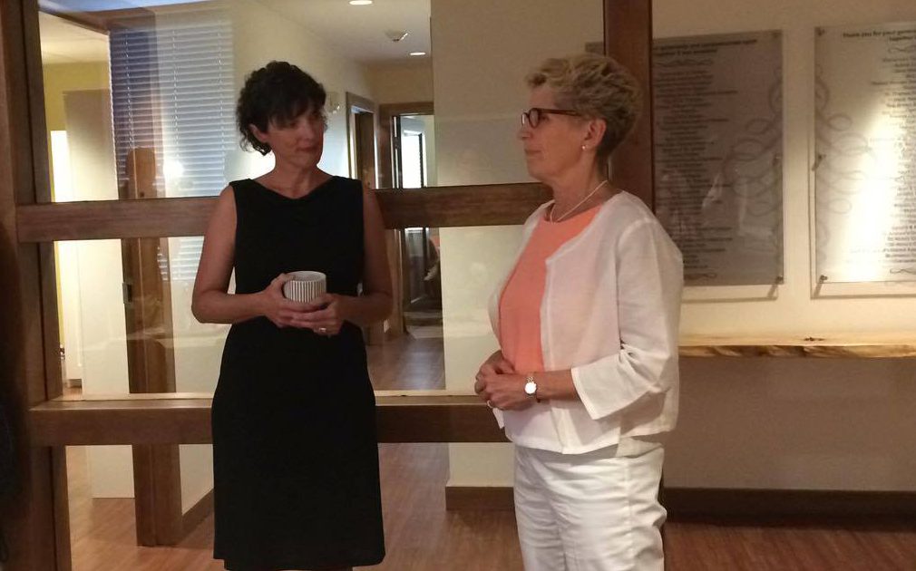 Premier Kathleen Wynne speaks with LAWS Executive Director Liz Brown, during a photo opportunity at the St. Thomas women's shelter, Thursday. 