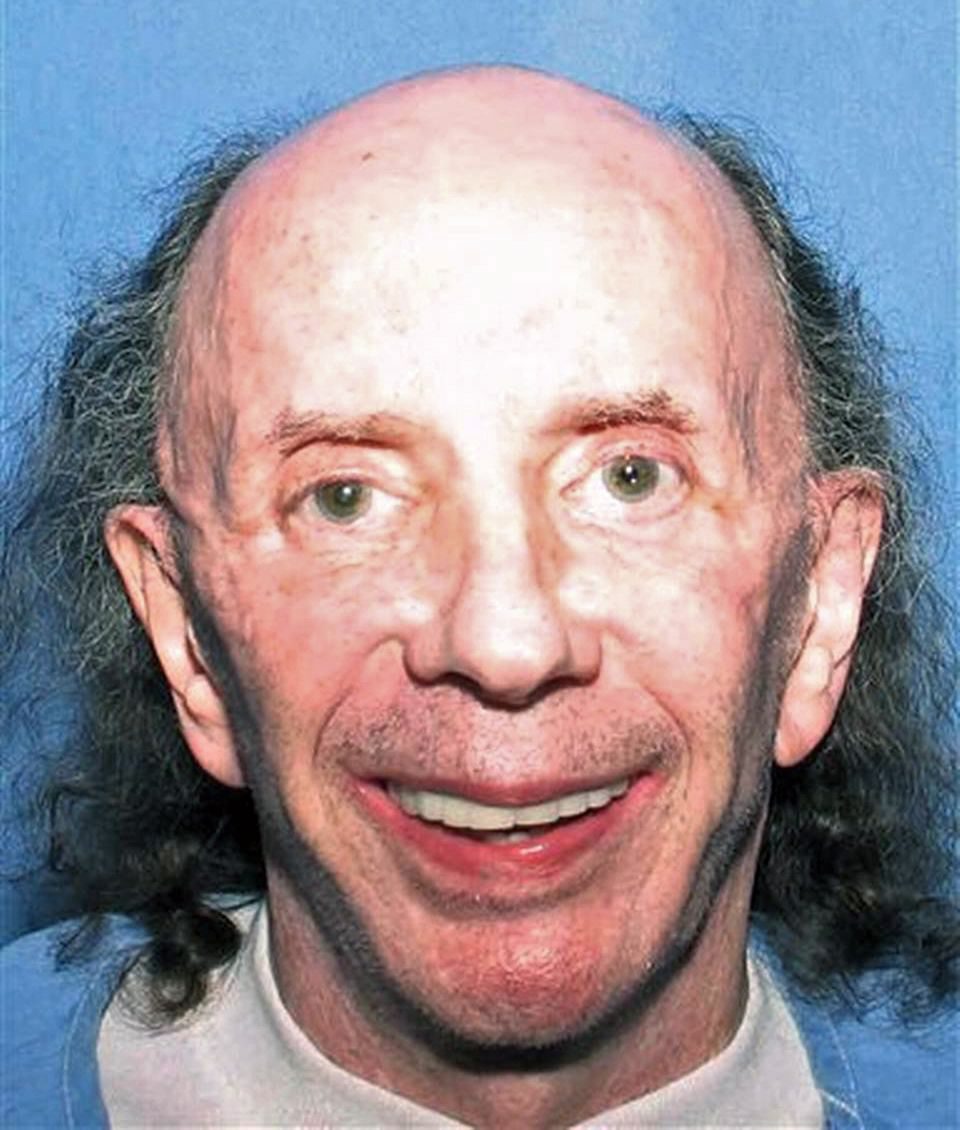 Music producer Phil Spector, 73, looking happy and smiling at the camera, pictured in a new prison mugshot released by the California Department of Corrections and Rehabilitation. The photo was dated July 24, 2013.