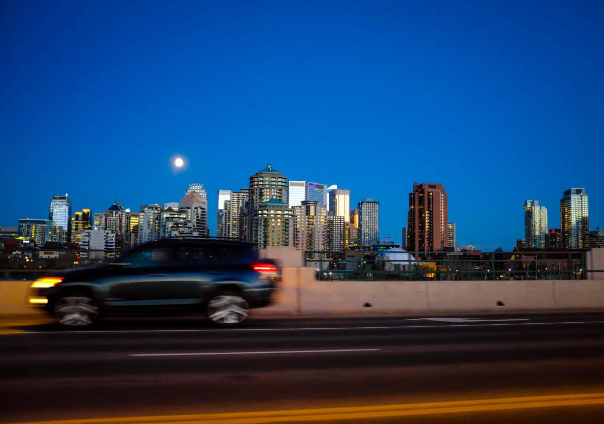 A full moon floats over Calgary, Alta., Saturday, Nov. 12, 2016.