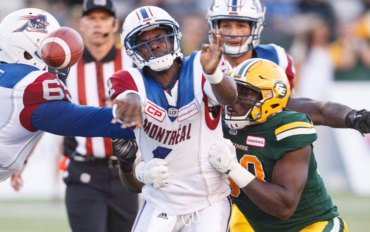Montreal Alouettes quarterback Darian Durant (4) is hit by Edmonton Eskimos' Kwaku Boateng (93) during first half CFL action in Edmonton on Friday, June 30, 2017. 