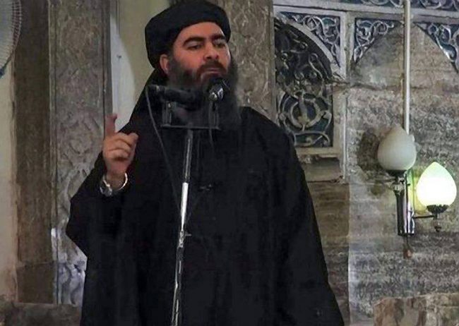 Abu Bakr al-Baghdadi, giving a speech in an unknown location.
