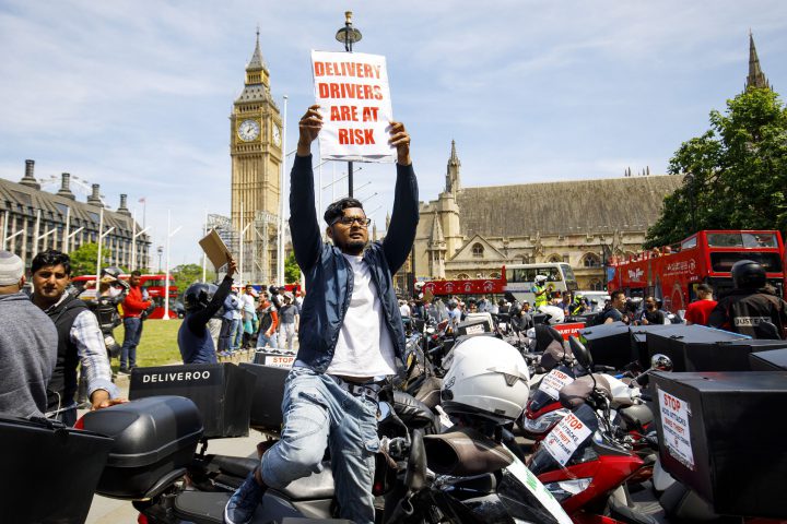Motorbiked couriers, mostly employed by Deliveroo and Uber Eats, stage a protest over acid attacks and motorcycles thefts in London, July 18.